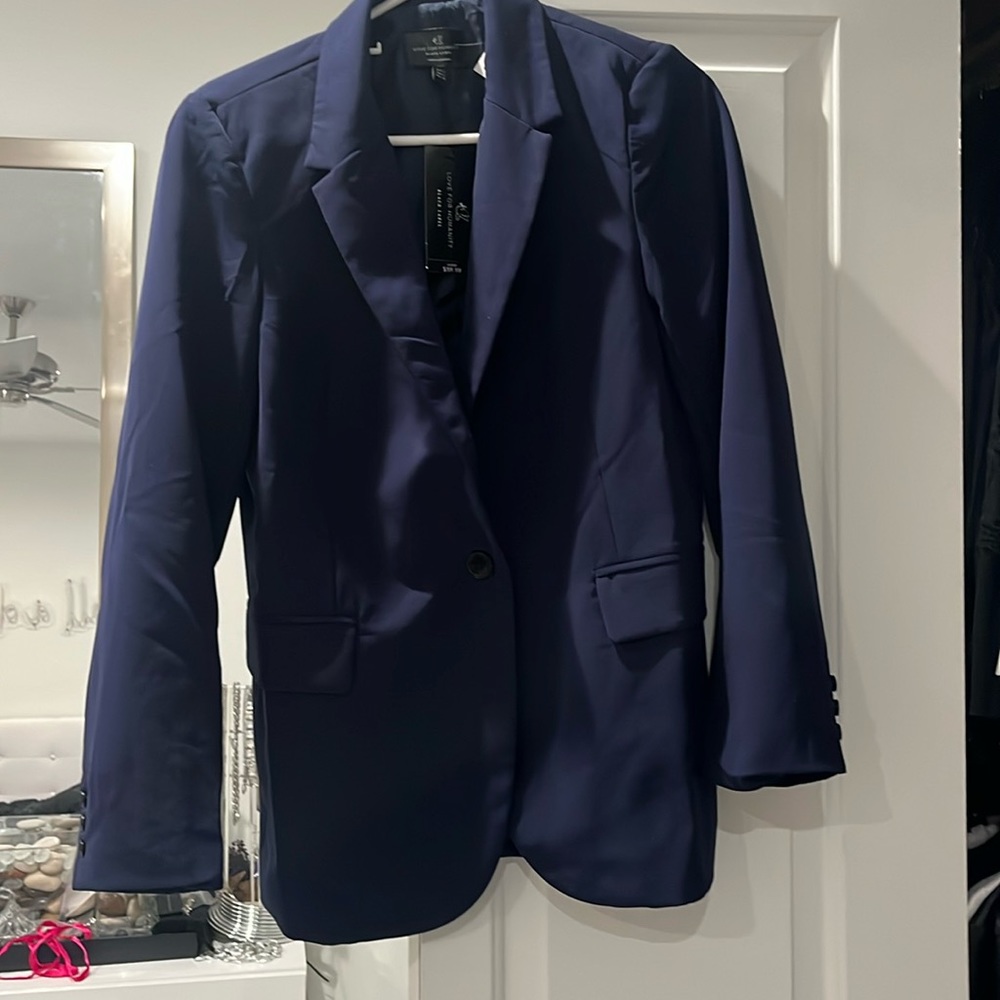 Navy blazer new with tags, size small, one button, front pockets, back slit